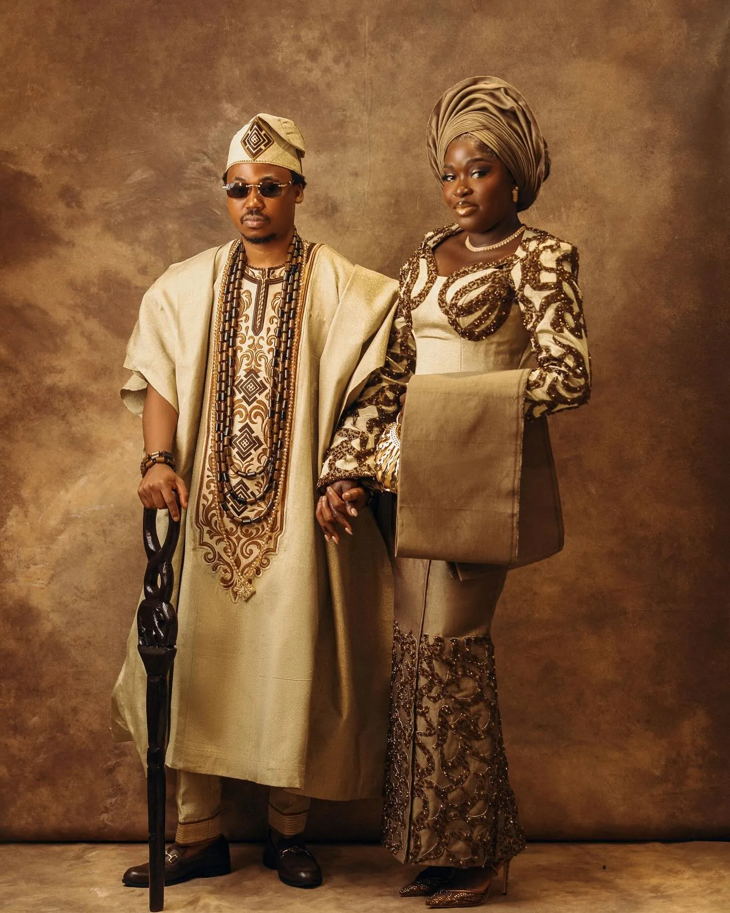 Couple standing full length in their traditional outfits