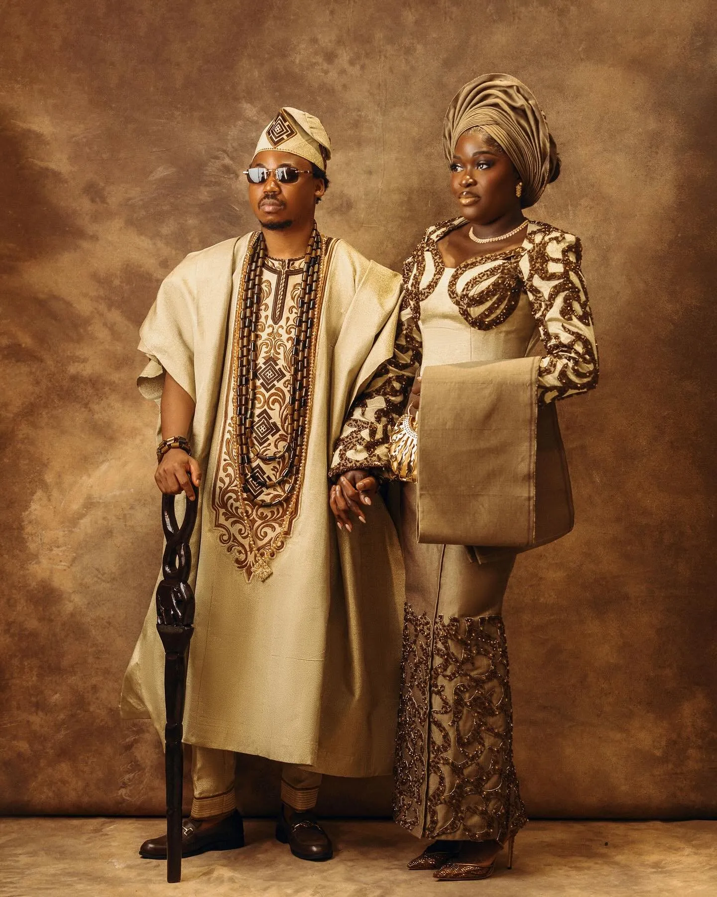 Couple side by side, groom leaning on his cane