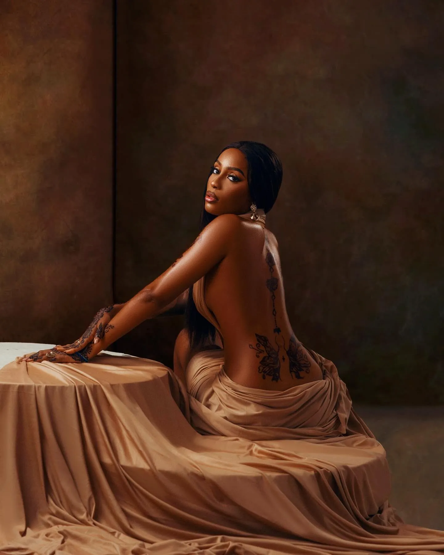 Back view showing the open back of the caramel drape