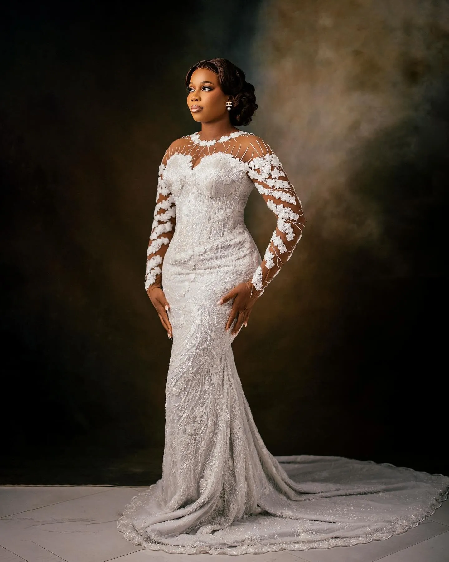 Bride standing full length, train spread around her