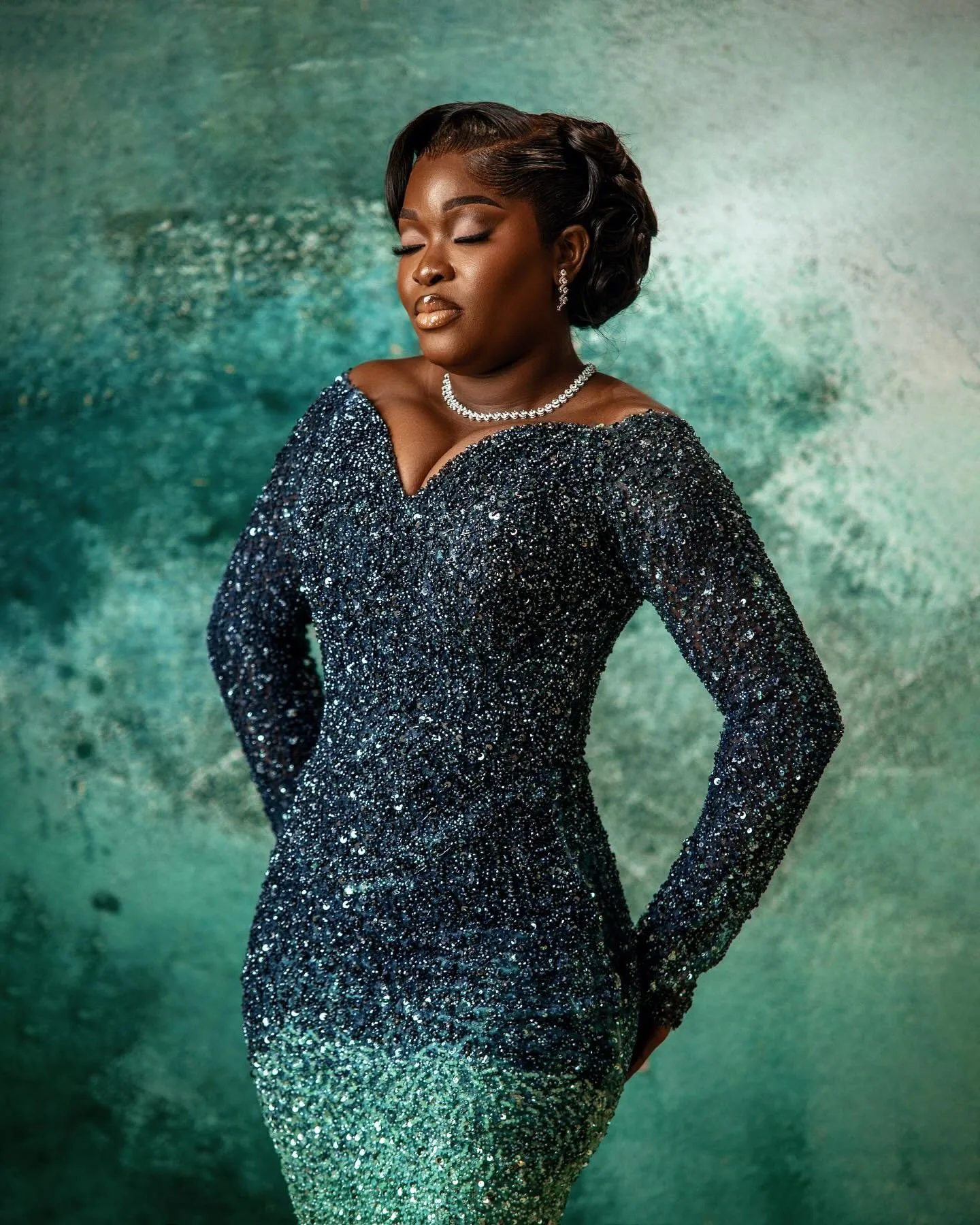Bride in the navy-to-teal gown