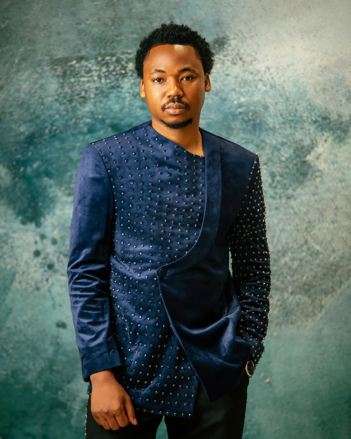 Groom in an embellished navy outfit