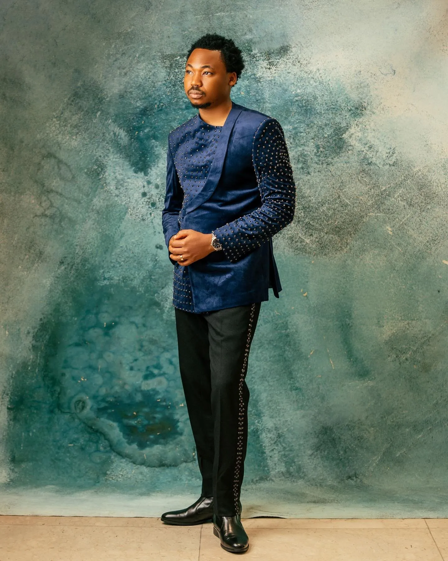 Groom standing full length in navy